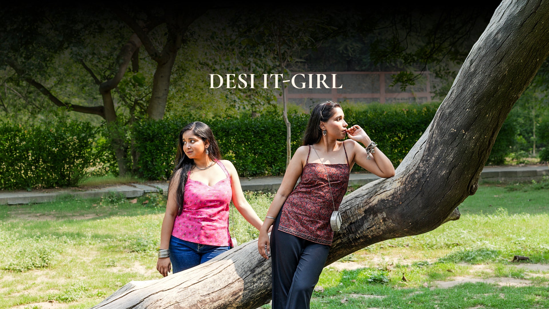 Two women standing under a large tree in a park with 'DESI IT-GIRL' text overlay.